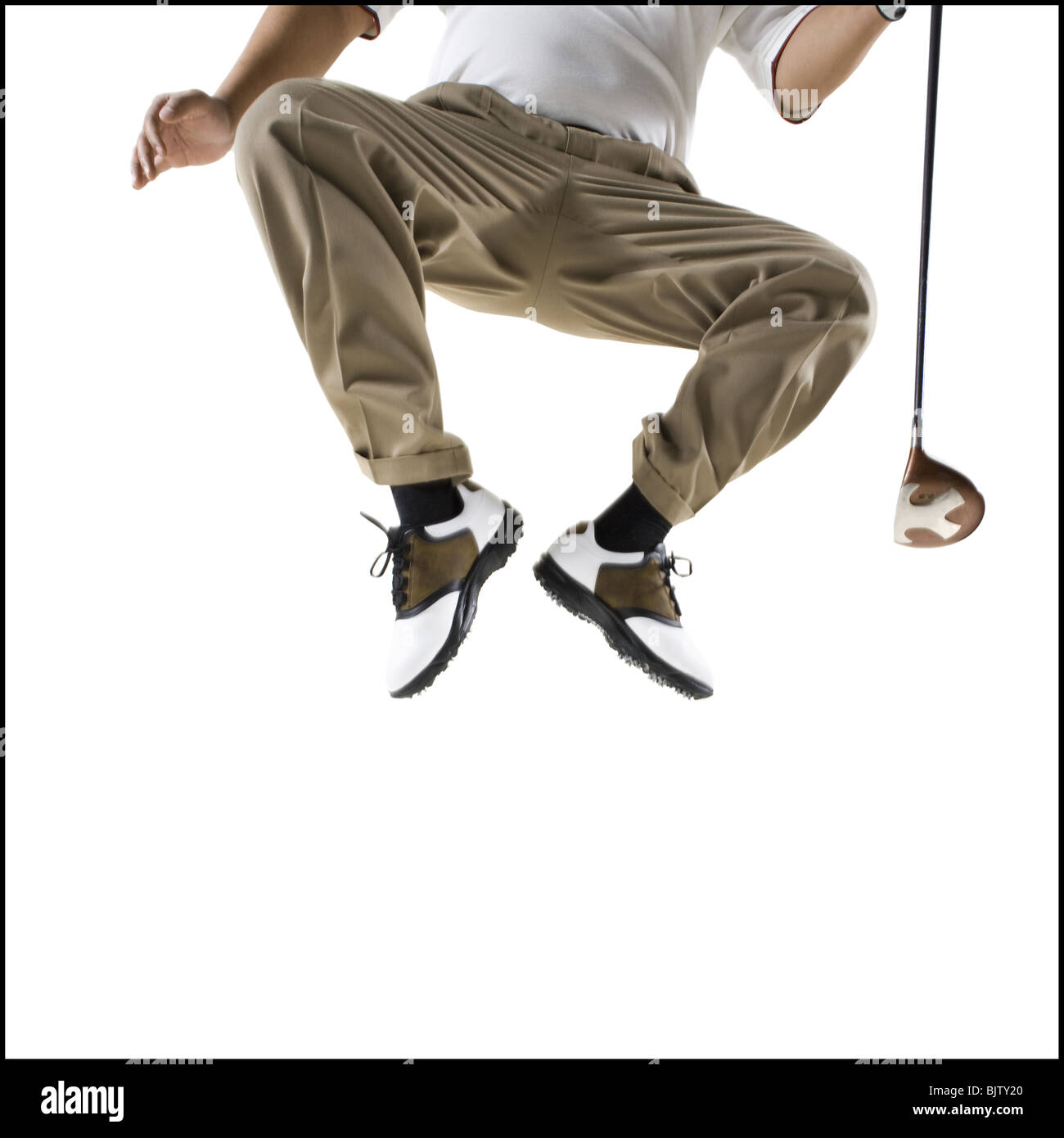 Il Golfer salta fuori il suolo Foto Stock