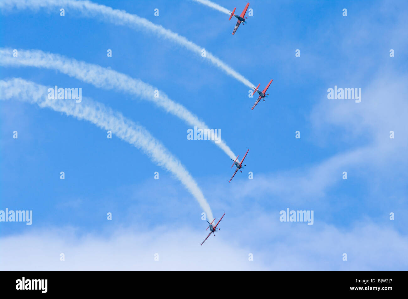 Le lame di volo acrobatico Team Display in 4 EA-300 aeromobili LP Foto Stock