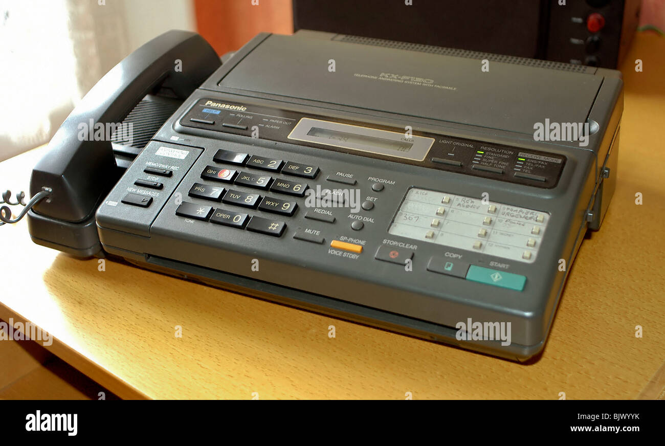 Combinazione di telefono, fax e segreteria telefonica in Home Office Foto  stock - Alamy