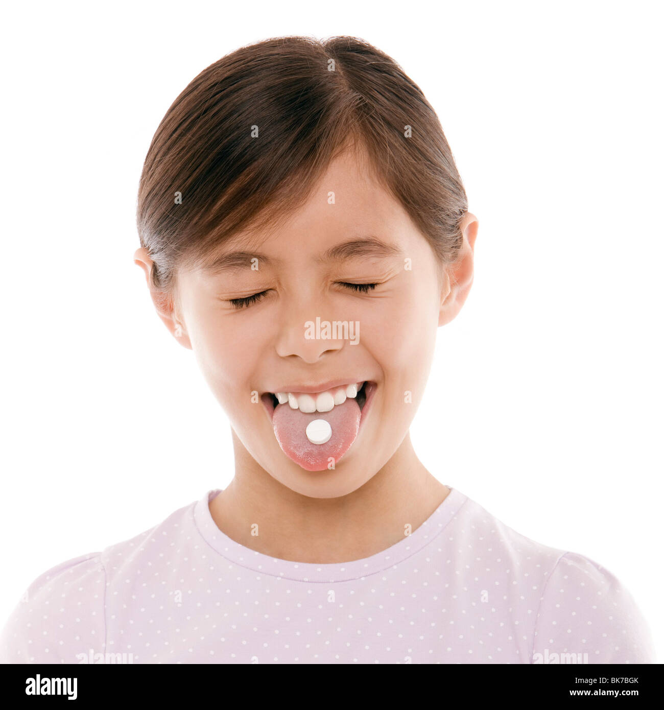 Ragazza tenendo antidolorifico Foto Stock