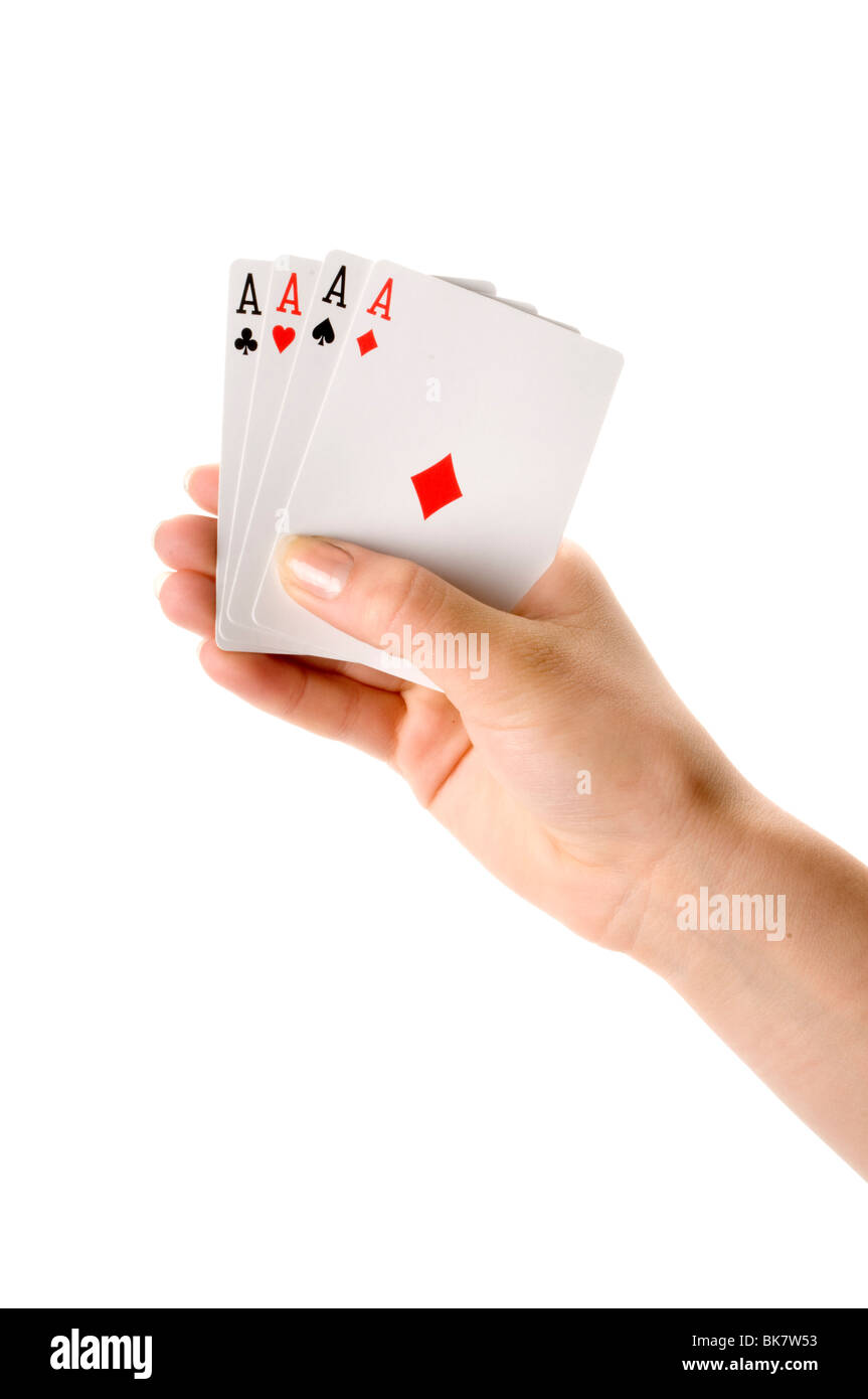 Mano che regge quattro assi Foto Stock