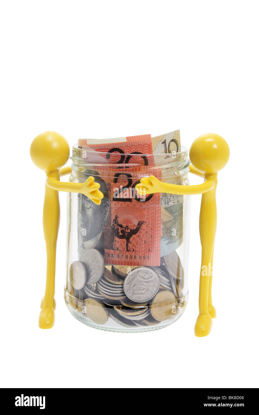 Gomma in miniatura le figure e Jar di denaro Foto Stock