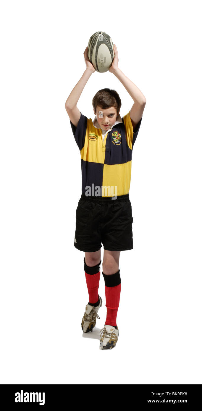 Ragazzo con una palla da rugby Foto Stock