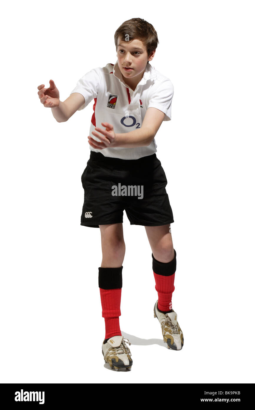 Ragazzo con una palla da rugby Foto Stock