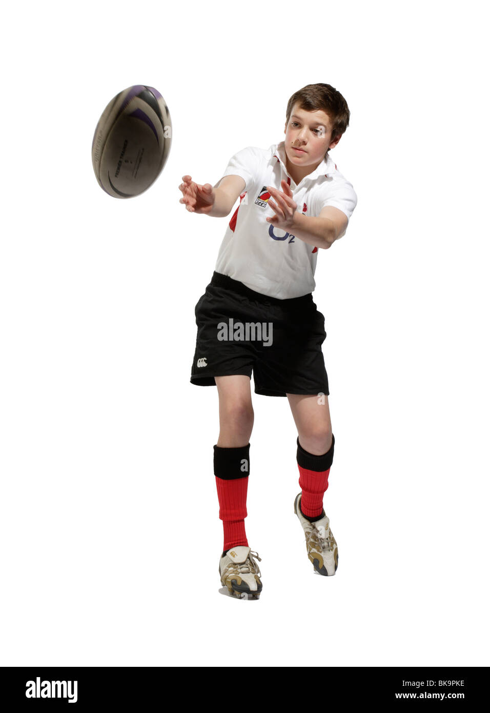 Ragazzo con una palla da rugby Foto Stock