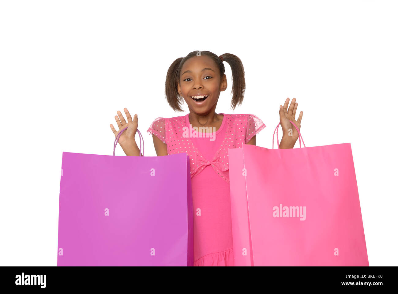 Dieci anni di ragazza con borse per lo shopping. Foto Stock