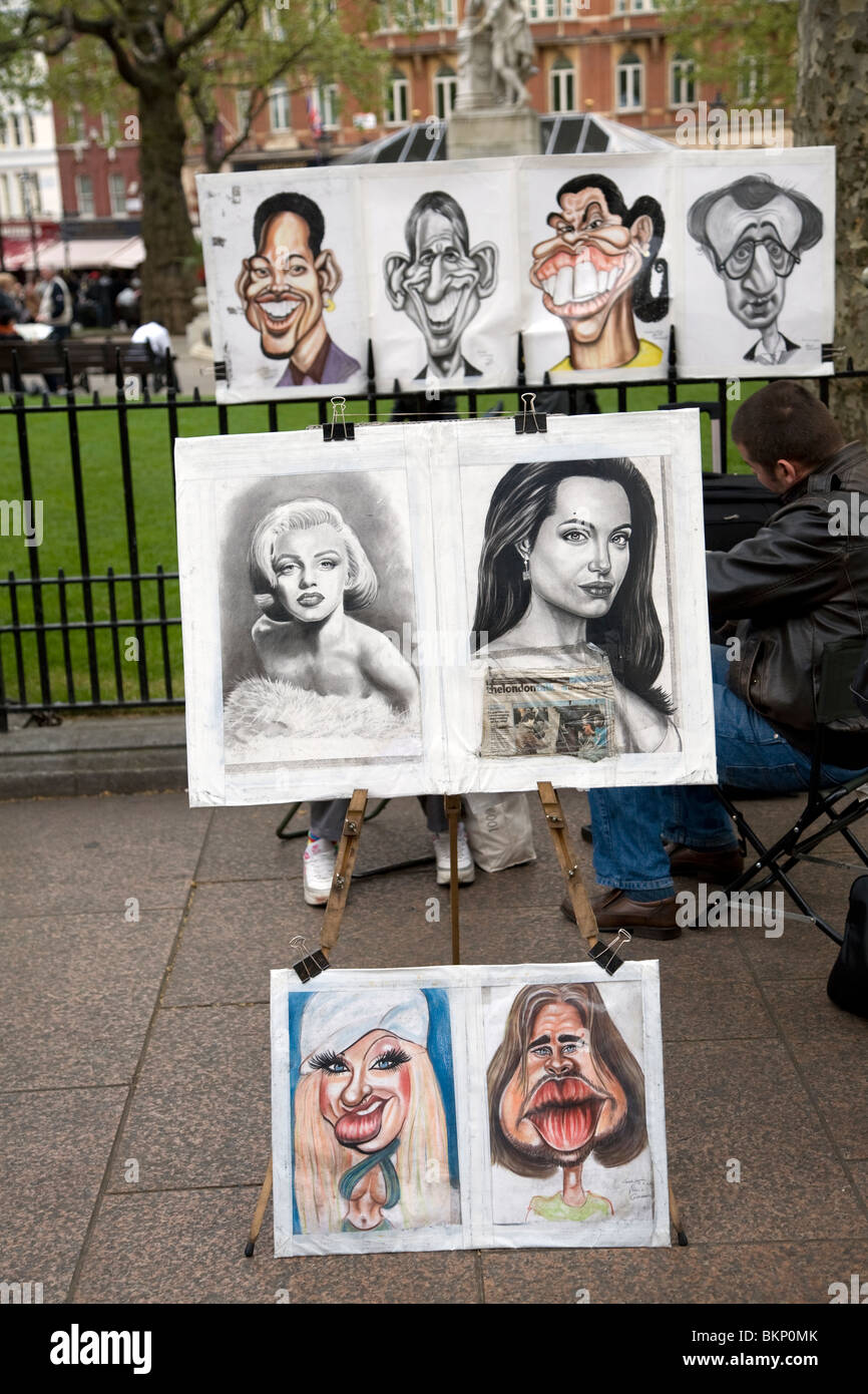 Ritratto di strada artista cartoni animati persone famose, Leicester Square, Londra, Inghilterra Foto Stock