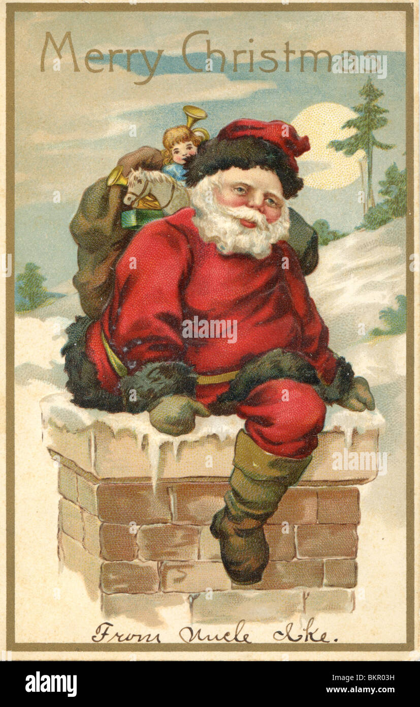 Babbo Natale scendendo giù il camino Foto Stock