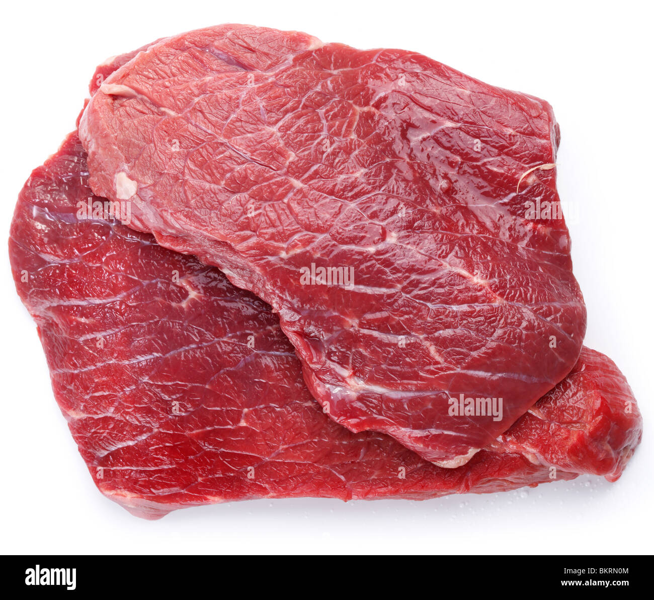 Carne cruda su sfondo bianco Foto Stock