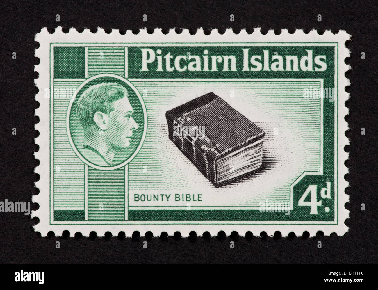 Francobollo dalle Isole Pitcairn raffiguranti la Bibbia dal H.M.S Bounty e George VI. Foto Stock