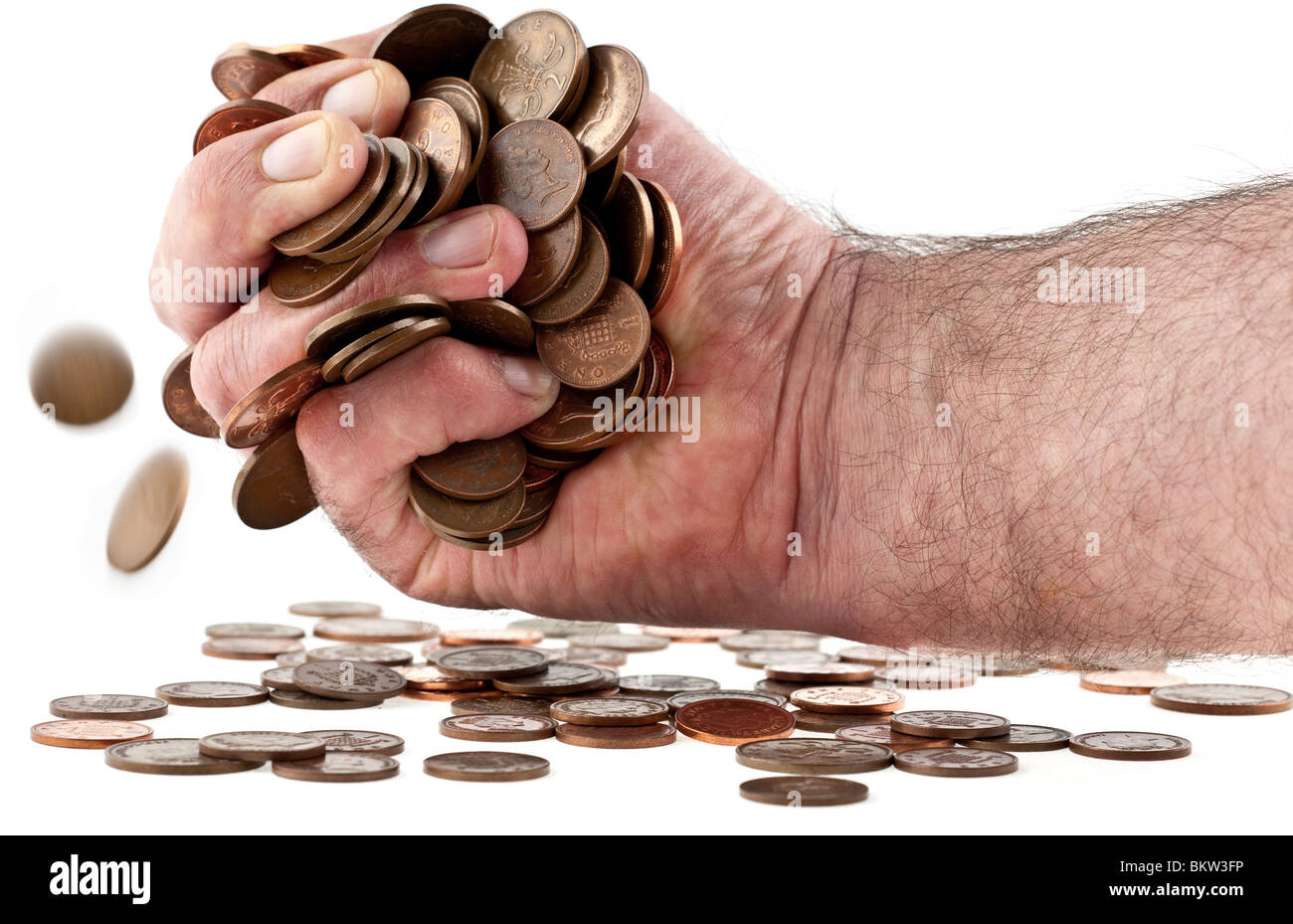 Man mano farciti con la valuta britannica di monete di rame Foto Stock