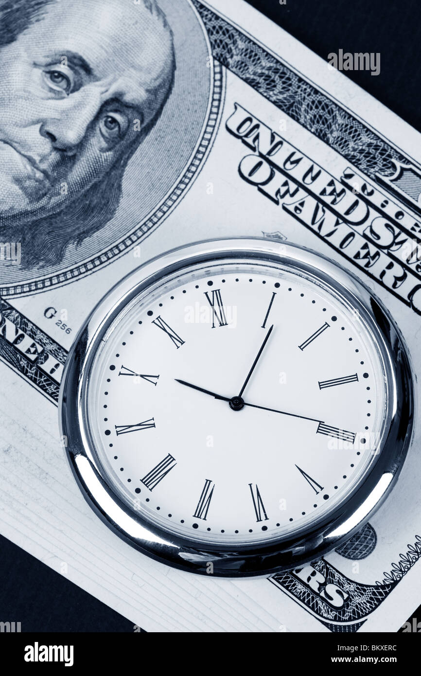 Il tempo è denaro, dollaro e orologio Foto Stock