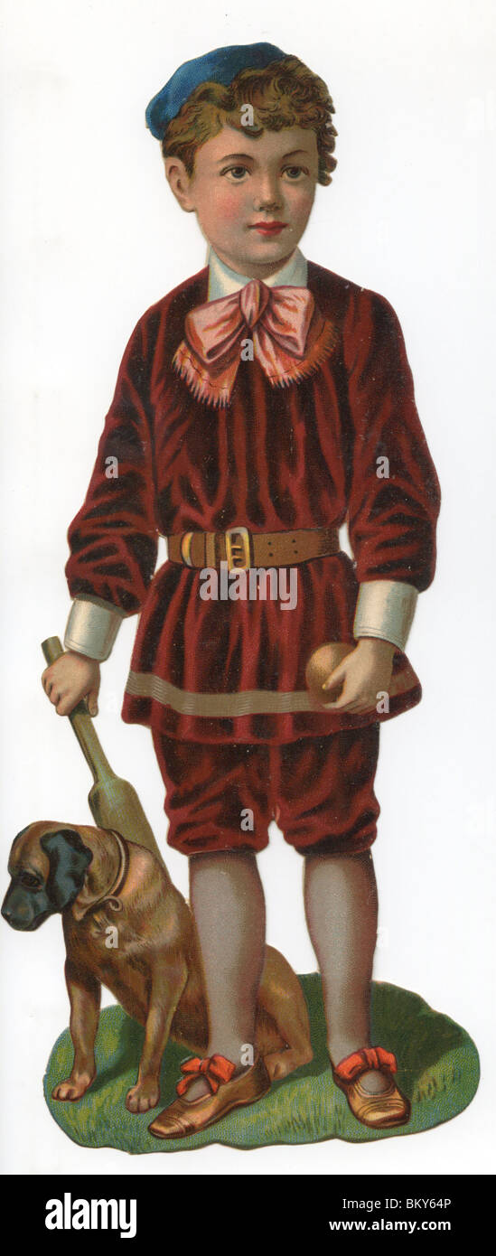 Ragazzo giovane vestito in costume rosso con il suo cane Foto Stock