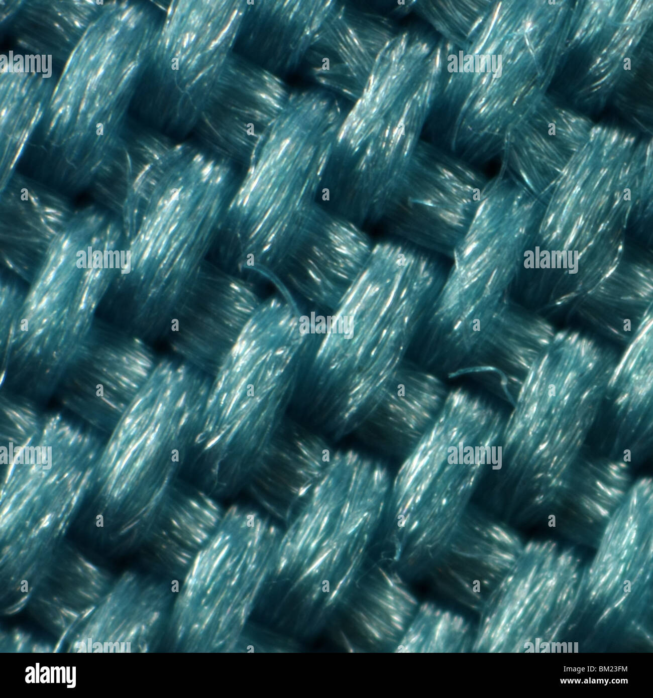 Extreme close-up compatto di tessuto blu. Tutti i lati della foto sono esattamente un millimetro lungo. Foto Stock