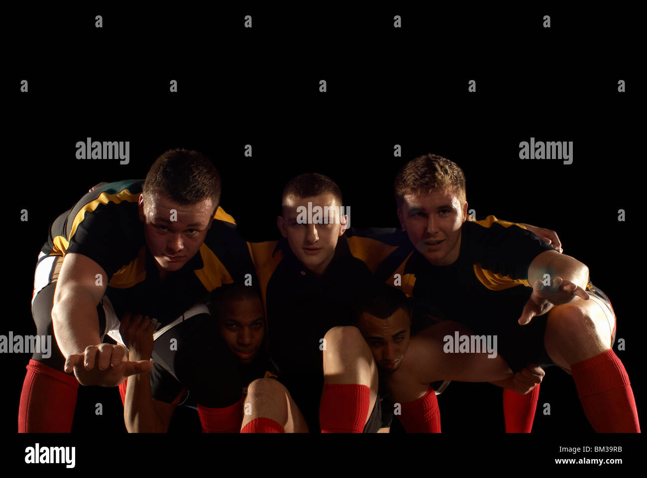 Giocatori di rugby in scrum formazione Foto Stock