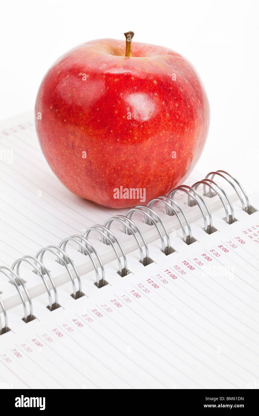 Red apple e Personal Organizer close up Foto Stock