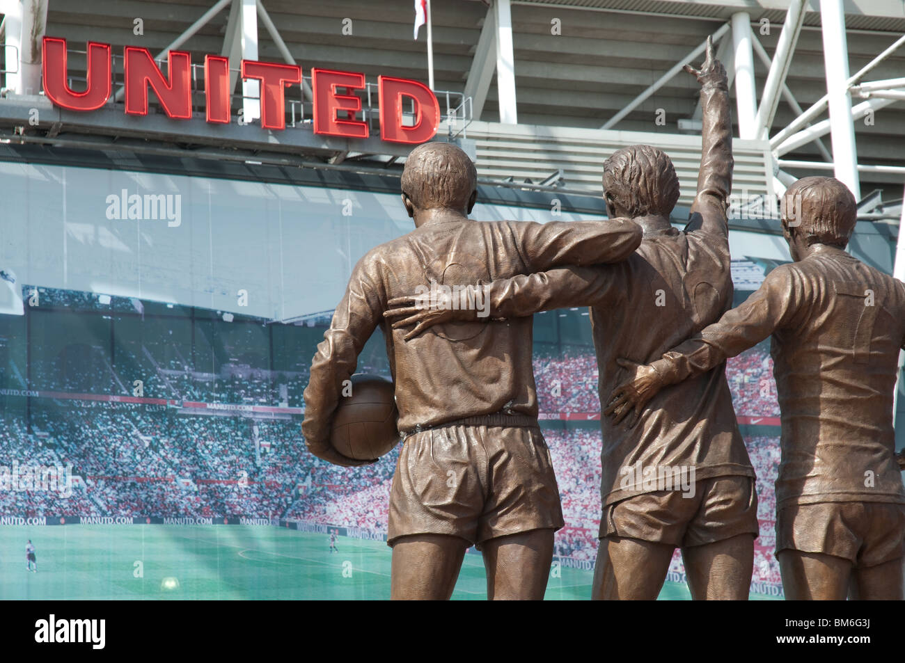 Il Manchester United, Santa Trinità statua a Old Trafford, Manchester, Inghilterra Foto Stock