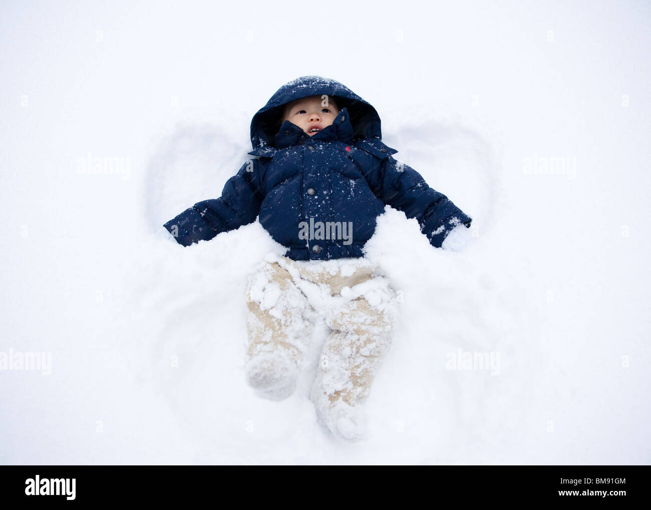 Asian baby boy in snow Foto Stock