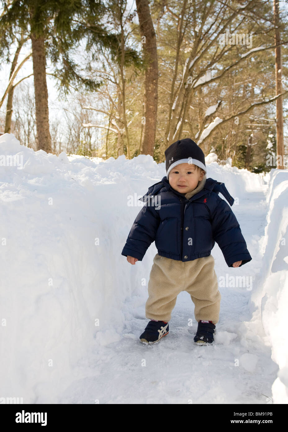 Asian baby boy in snow Foto Stock