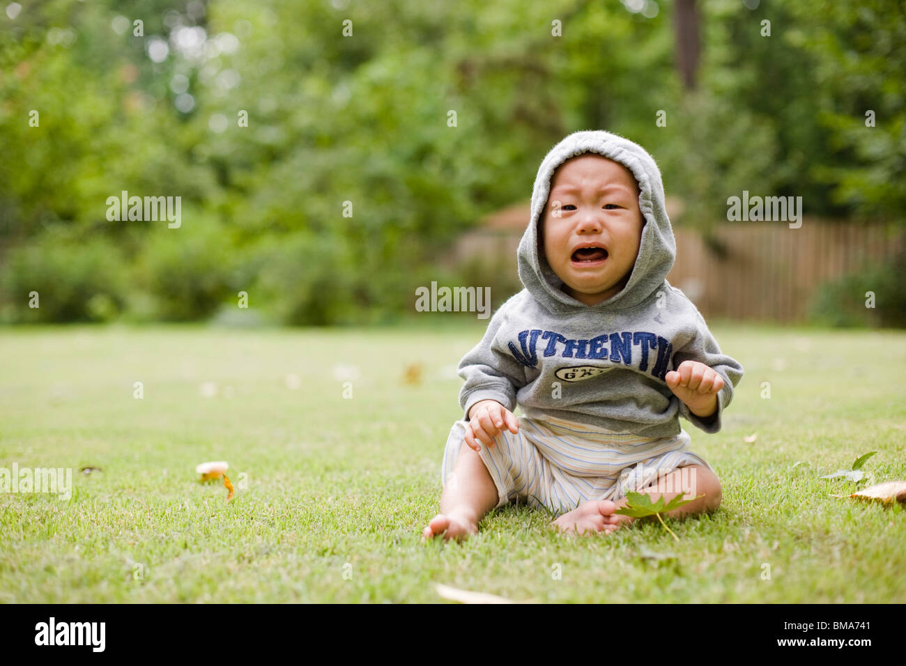 Il pianto Asian baby boy Foto Stock