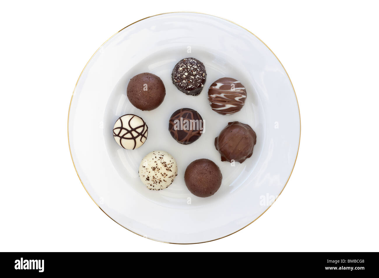 Otto premium circolare morbido cioccolatini centrato su una piastra bianca Foto Stock