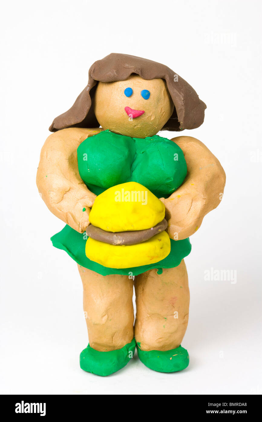 Figurine di plastilina, grasso ragazza con hamburger Foto Stock