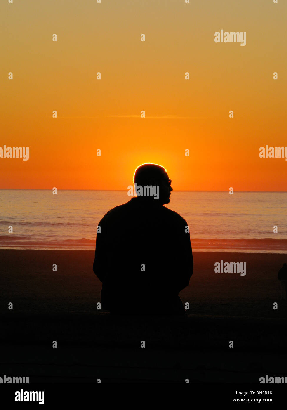 Sunset Silhouette di un uomo Foto Stock