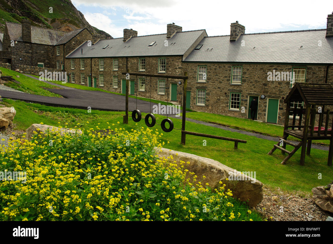Una fila di cottage in pietra in Nant Gwrtheyrn, lingua gallese di apprendimento e di insegnamento centro, Lleyn Peninsula, Gwynedd Galles del Nord Foto Stock