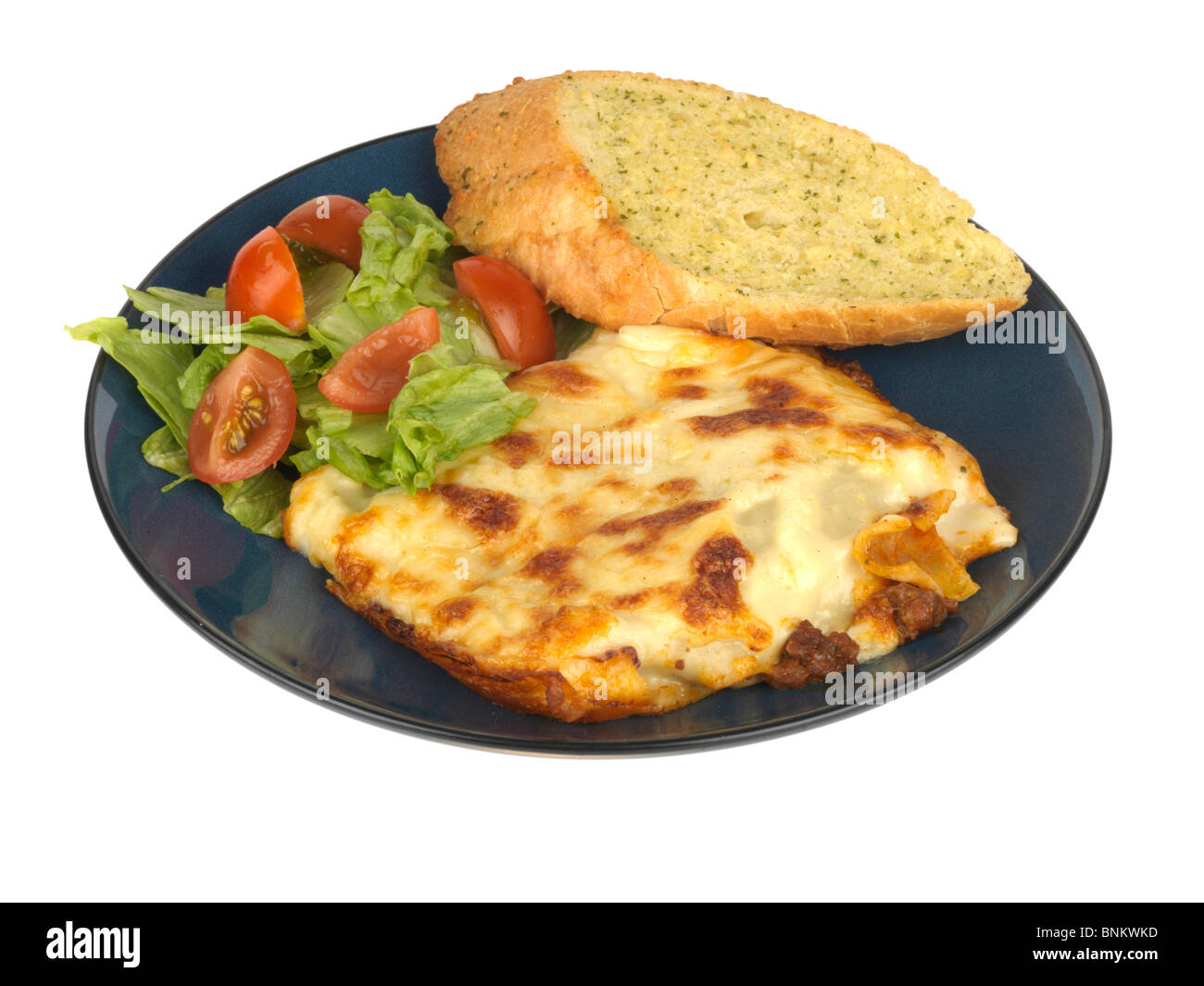 Porzione di lasagne con aglio pane Foto Stock