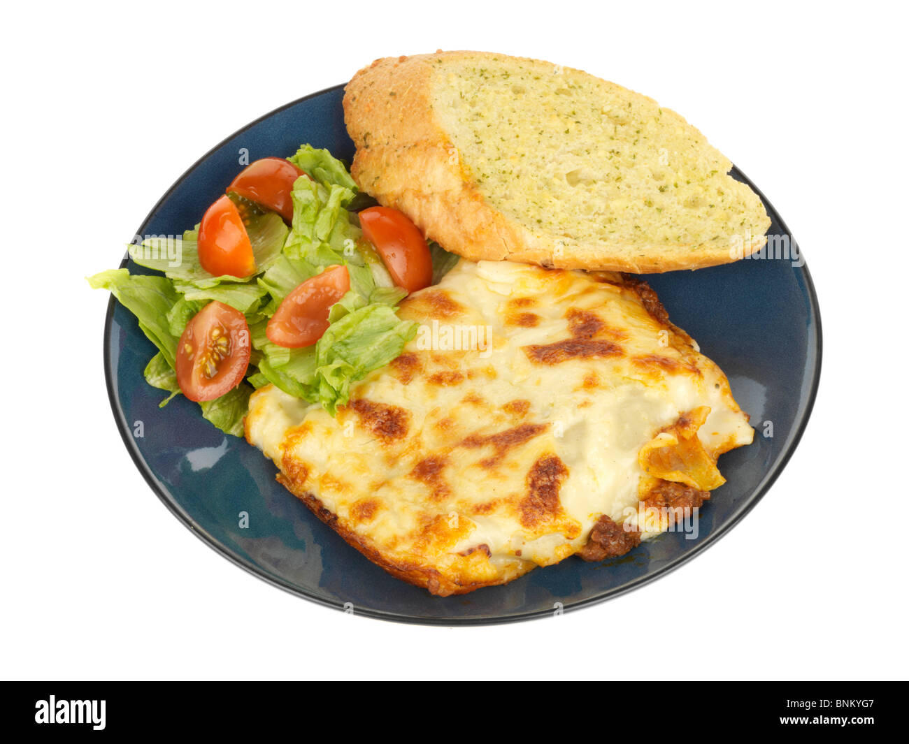 Porzione di lasagne con aglio pane Foto Stock