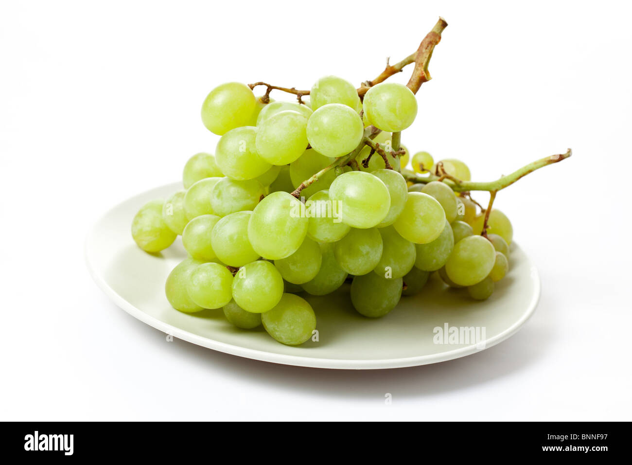 Gustose uve su sfondo bianco Foto Stock
