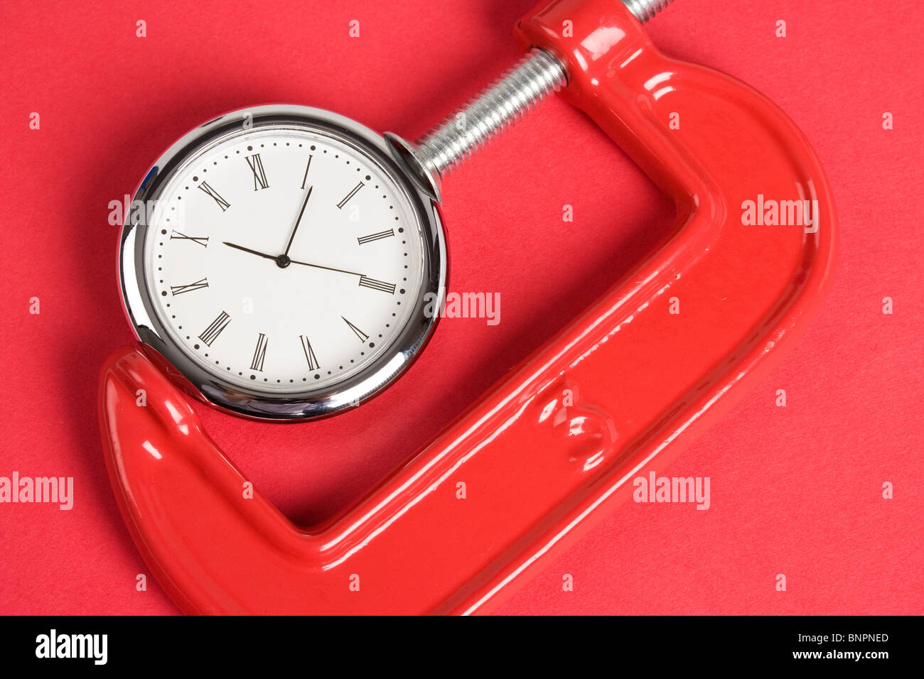 Vise Grip e orologio, concetto di occupato Foto Stock