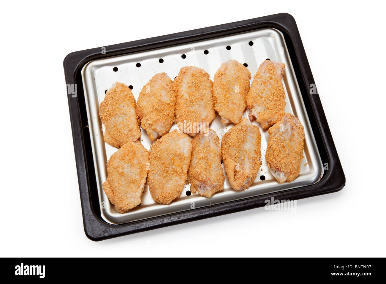 Ali di pollo sulla placca da forno Foto Stock