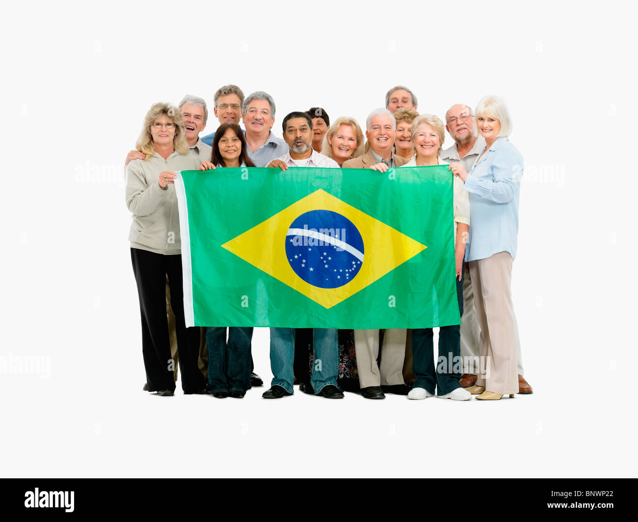 Gruppo di persone che sostengono la bandiera brasiliana Foto Stock