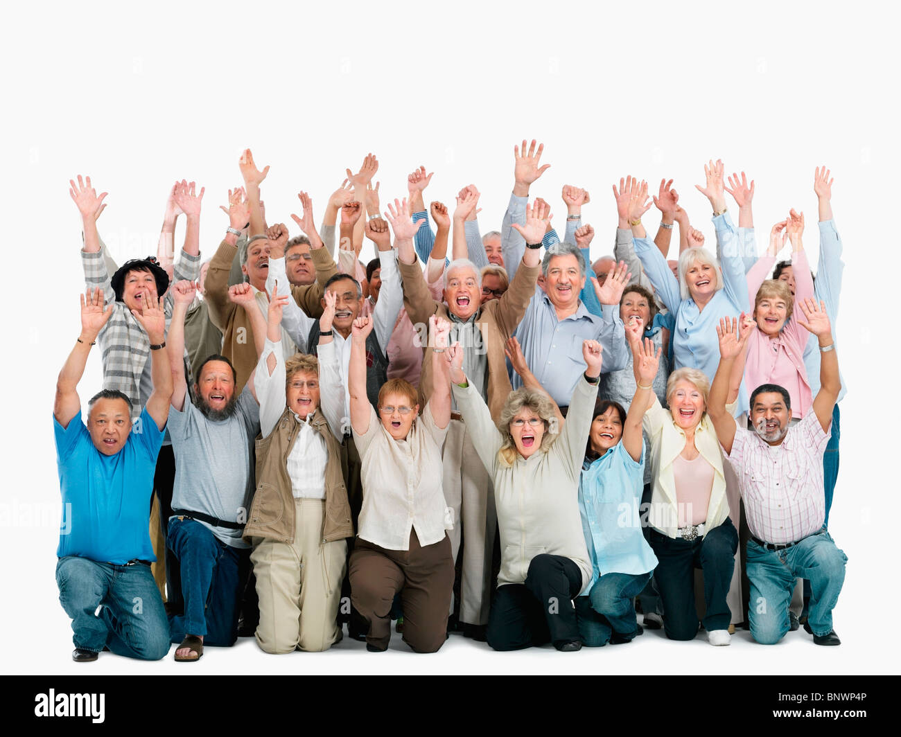 Un gruppo di persone con le braccia alzate Foto Stock