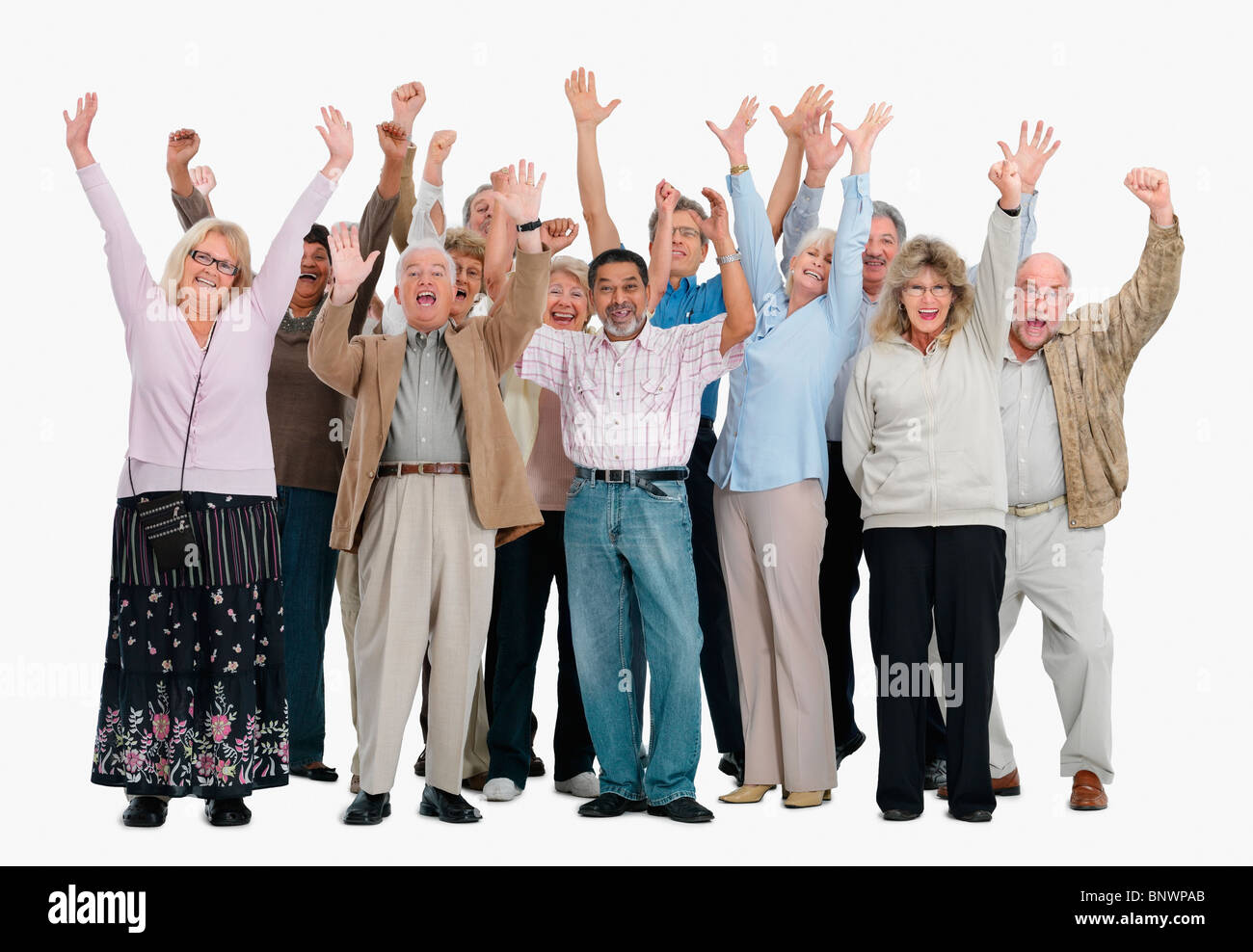 Un gruppo di gente entusiasta alzando le braccia in aria Foto Stock