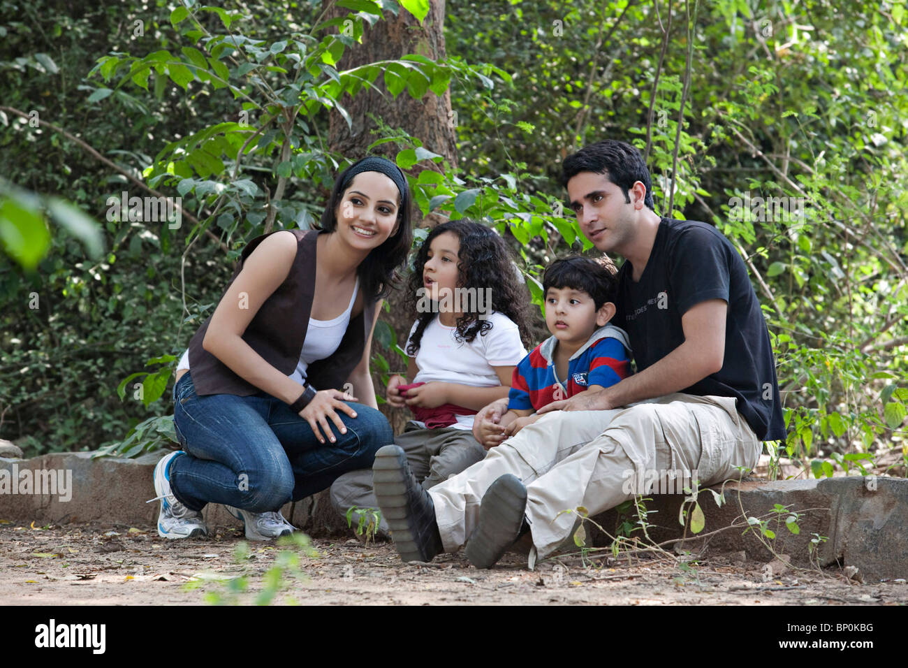 La famiglia in un parco Foto Stock