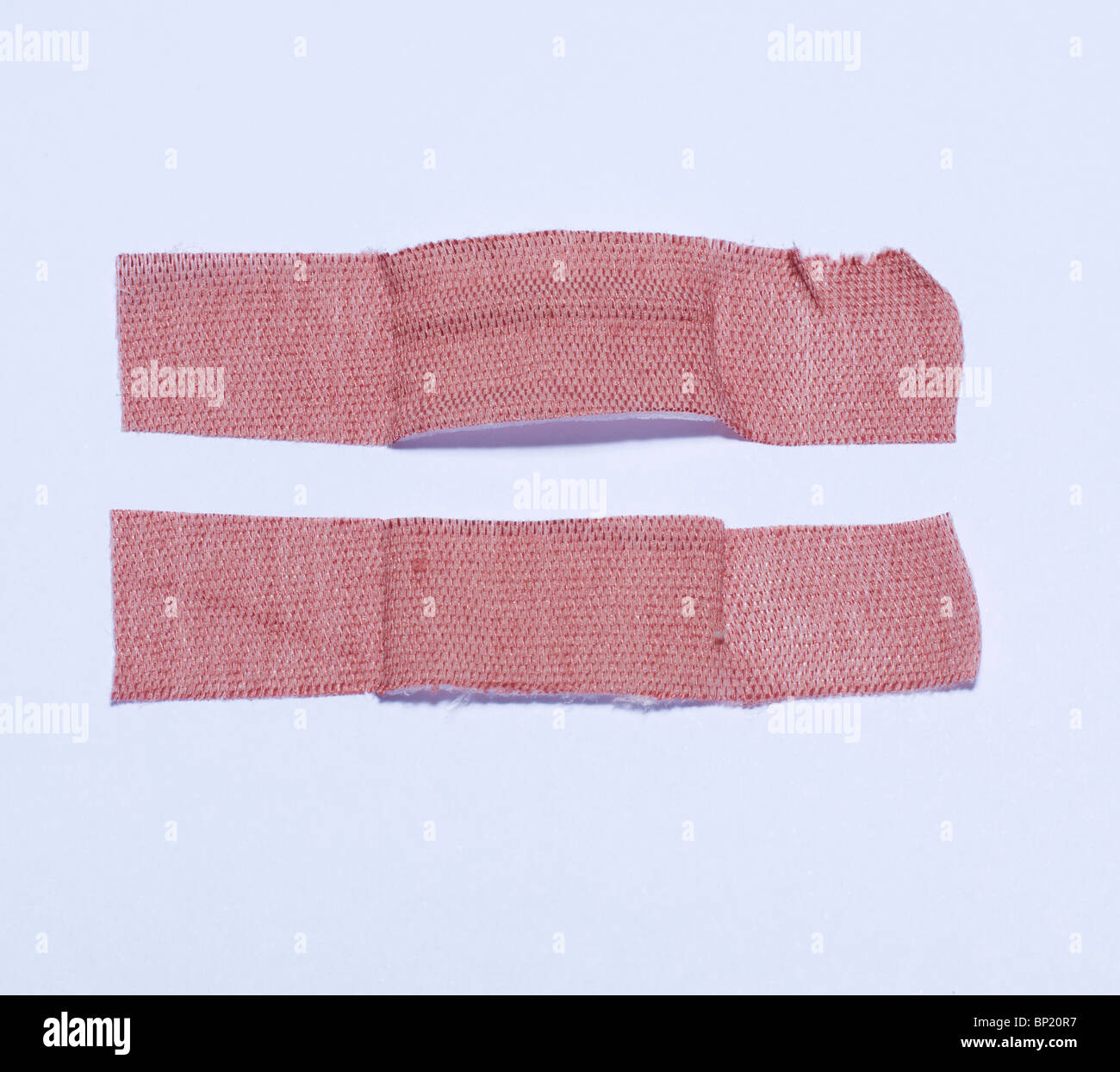 Primo soccorso cerotti nella forma di un simbolo = Foto Stock