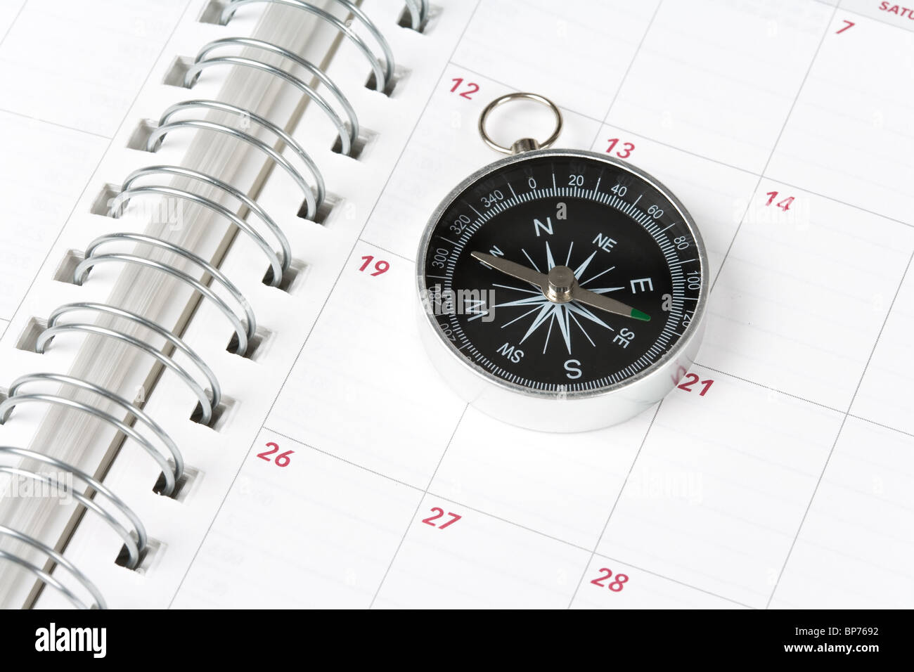 Il calendario e la bussola, concetto di pianificazione del tempo Foto Stock