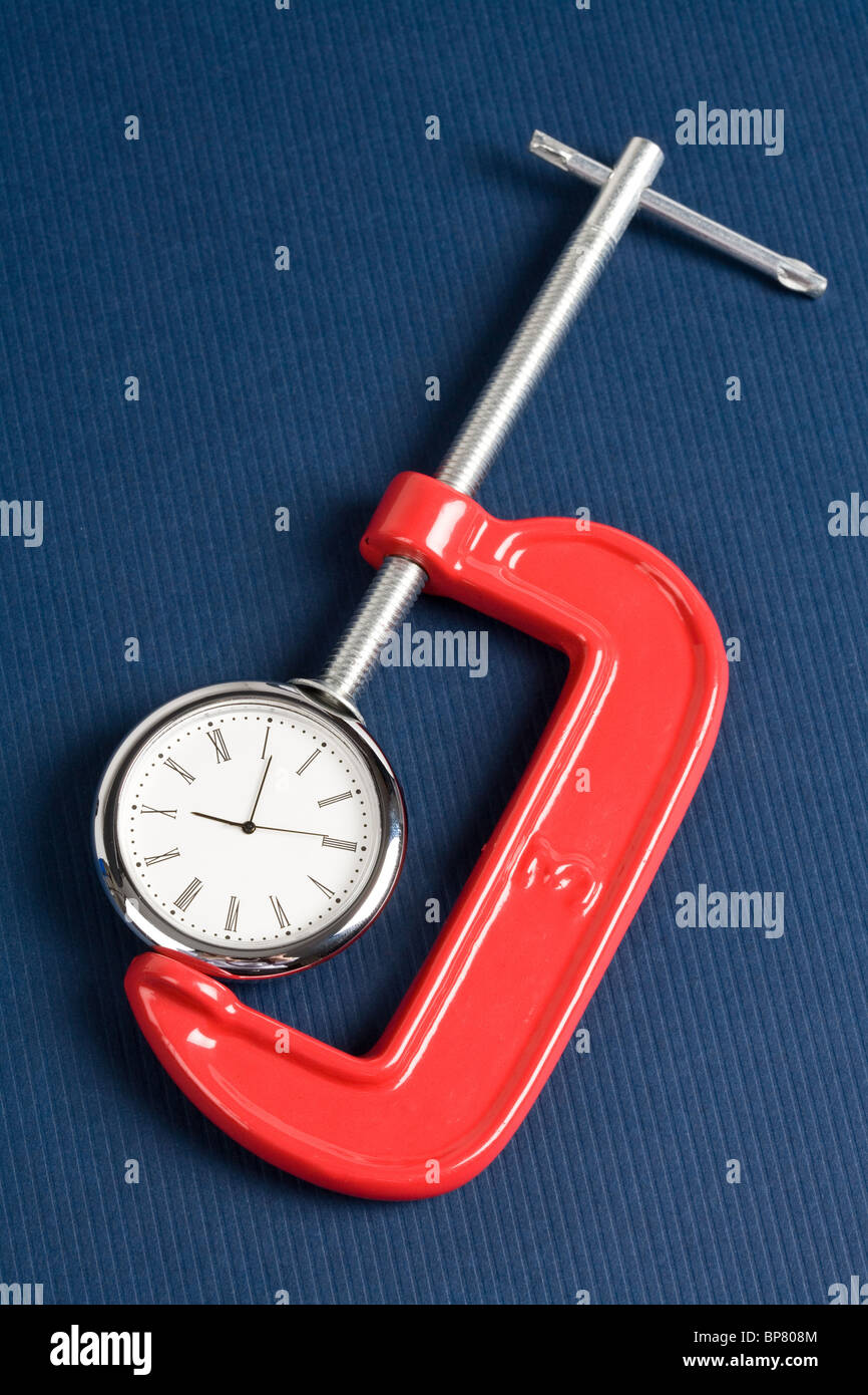 Vise Grip e orologio, concetto di occupato Foto Stock