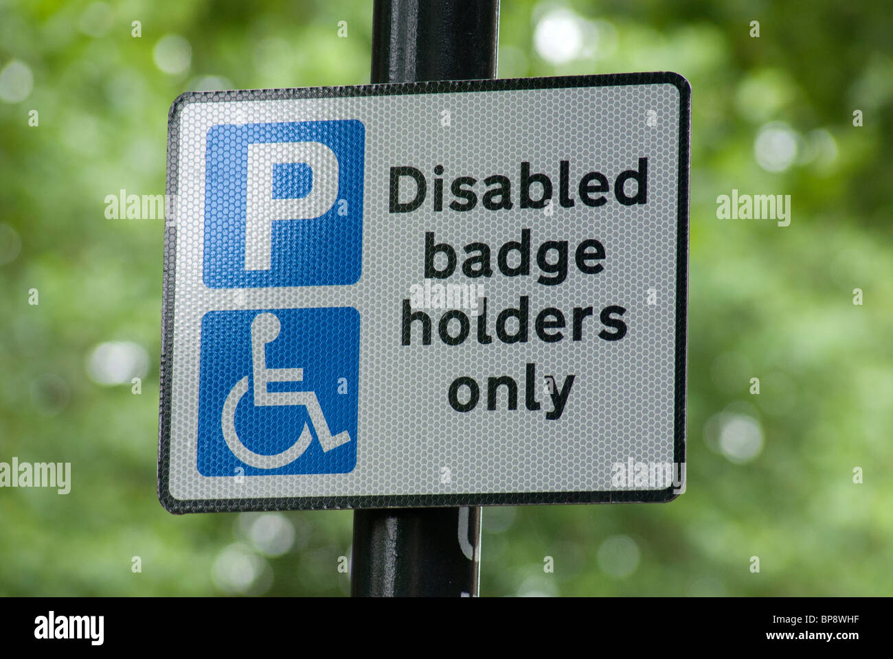 Badge disabili titolari simbolo di parcheggio Foto Stock