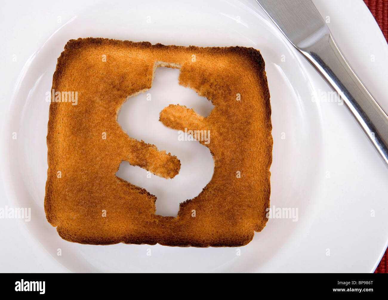 Il dollaro è di toast metafora dell'immagine. Foto Stock