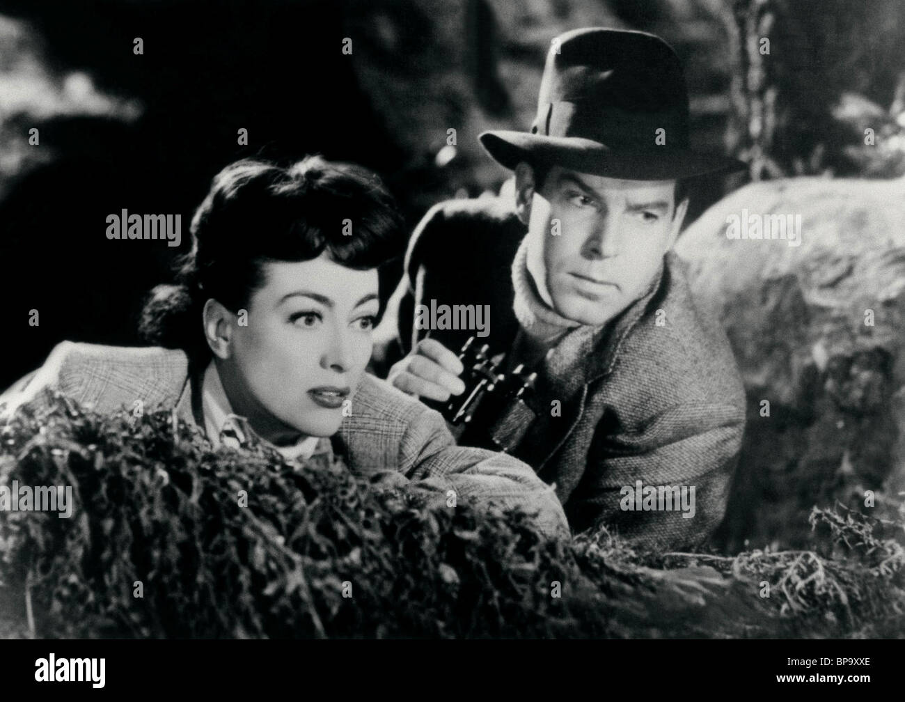 JOAN CRAWFORD, FRED MACMURRAY, al di sopra di ogni sospetto, 1943 Foto Stock