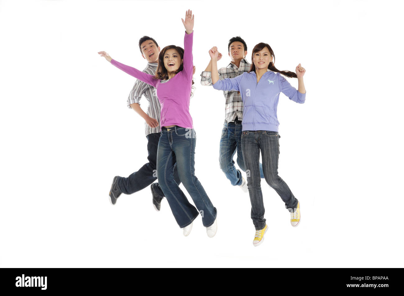 Un gruppo di studenti universitari jumping Foto Stock Un gruppo di studenti universitari jumping Foto Stock
