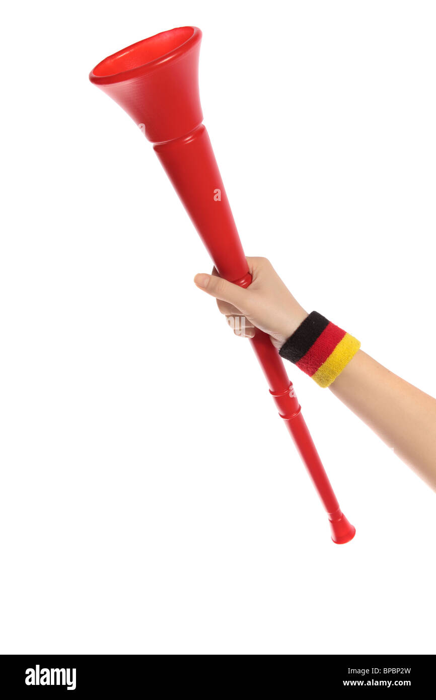 Una mano di tedesco sostenitore tenendo un vuvuzela, la tromba tradizionale sudafricano di sostenitori. Foto Stock