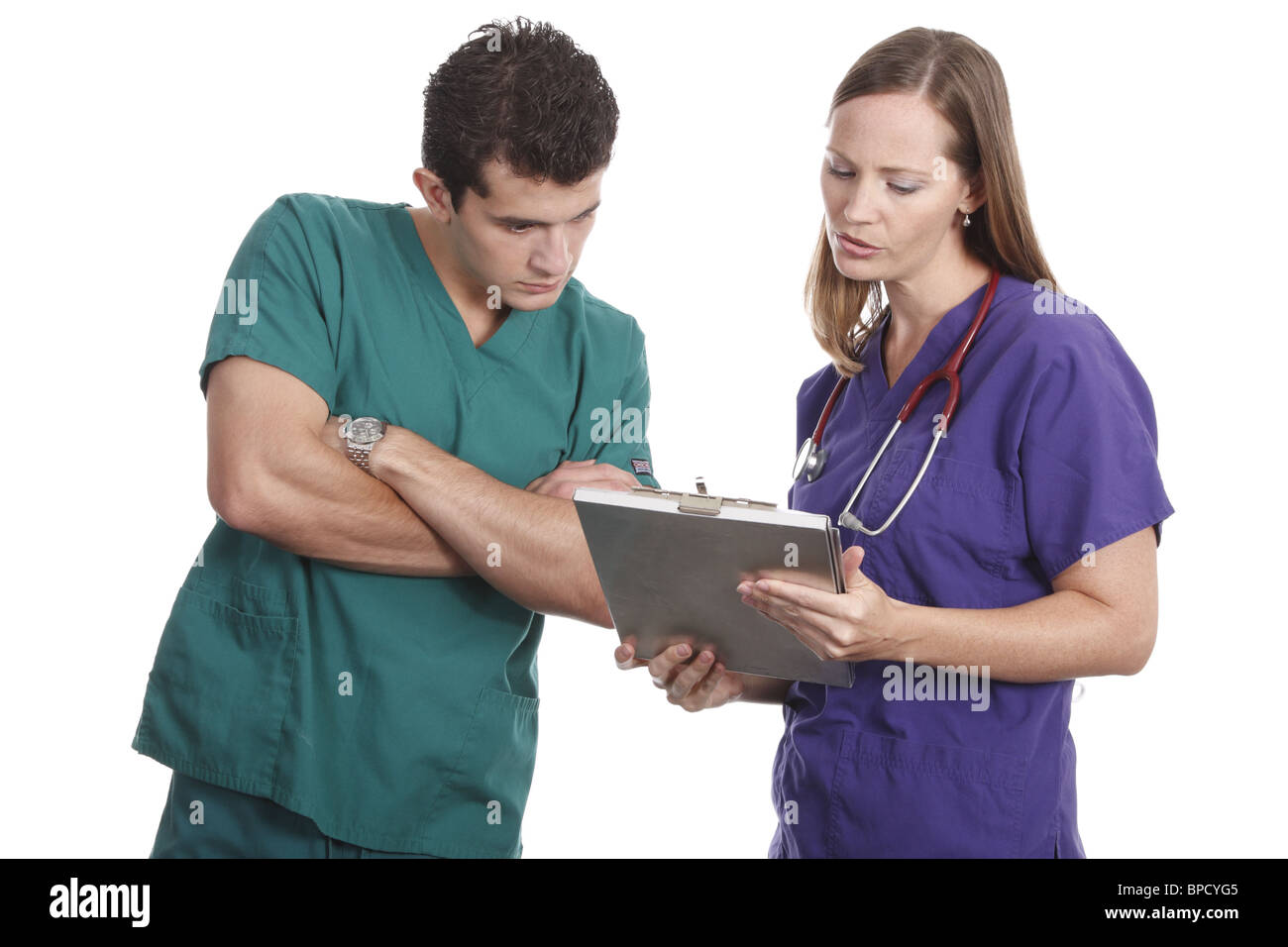 Gli infermieri a discutere di cartella paziente Foto Stock