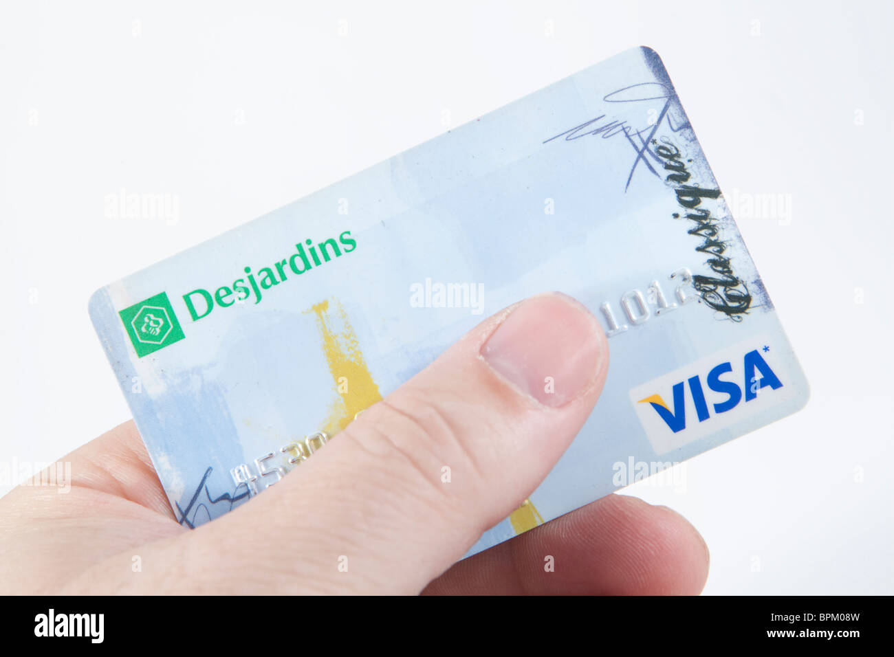 Un Desjardins con la carta di credito Visa su uno sfondo bianco. Foto Stock