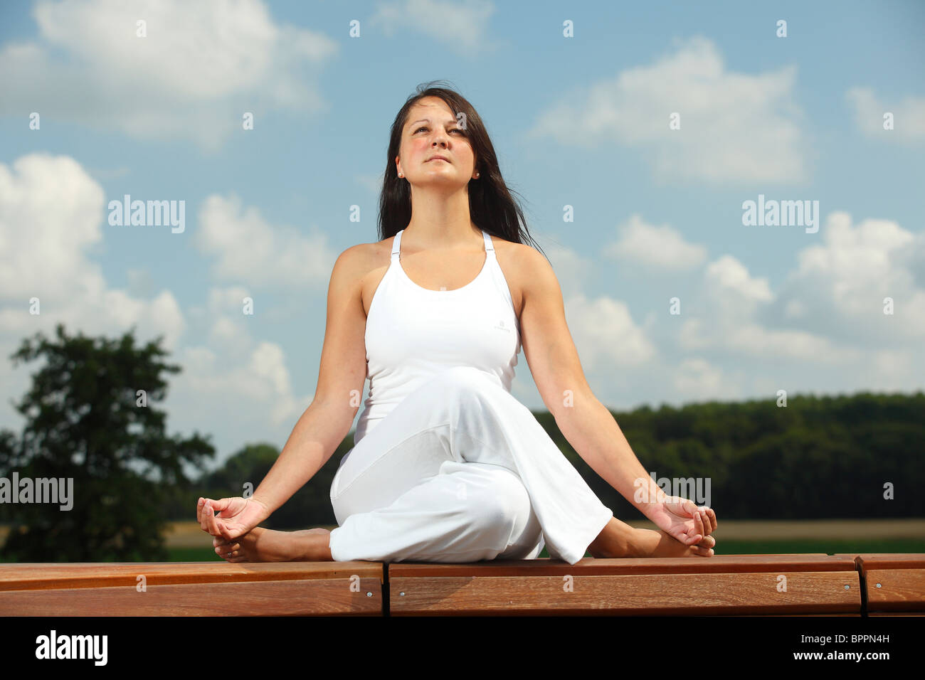 Lo Yoga "mucca faccia pongono' / esercizi yoga Foto Stock