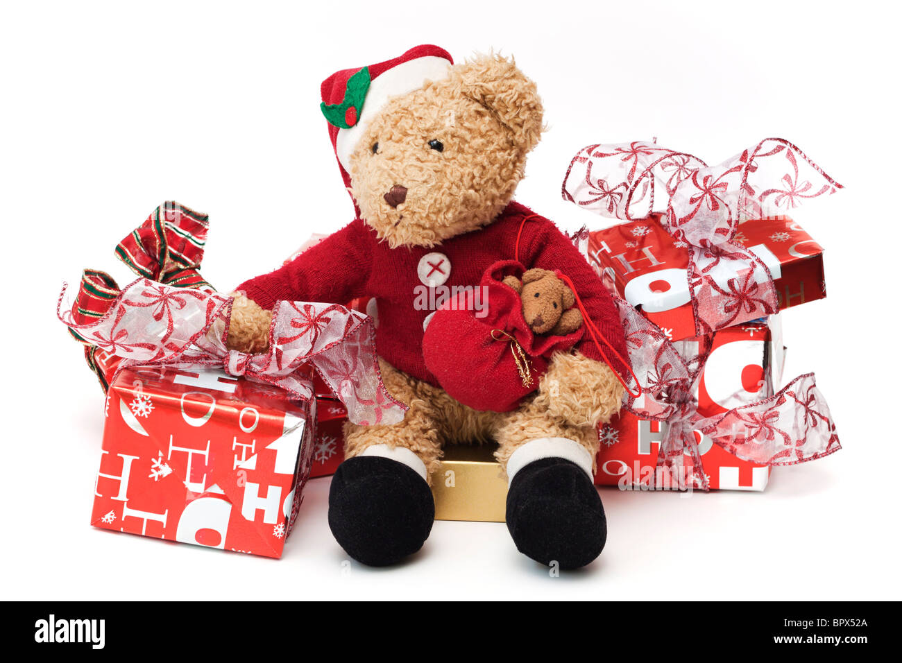 Immagini Di Bambini Vestiti Da Babbo Natale.Teddy A Natale Apprezzato Per Bambini Teddy Vestiti Da Babbo Natale Seduto Tra Avvolto I Regali Di Natale Foto Stock Alamy