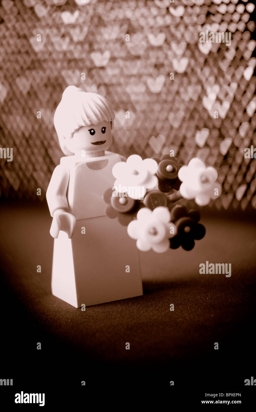 Una sposa Lego con fiori in seppia con cuore personalizzato bokeh di fondo  Foto stock - Alamy
